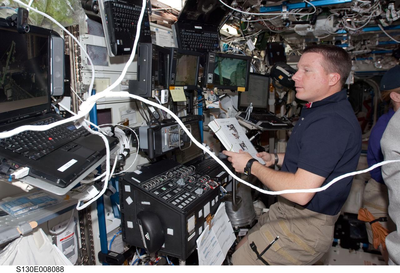 S130-E-008088 (15 Feb. 2010) --- NASA astronaut Terry Virts, STS-130 pilot, works at a robotic workstation in the Destiny laboratory of the International Space Station while space shuttle Endeavour remains docked with the station.