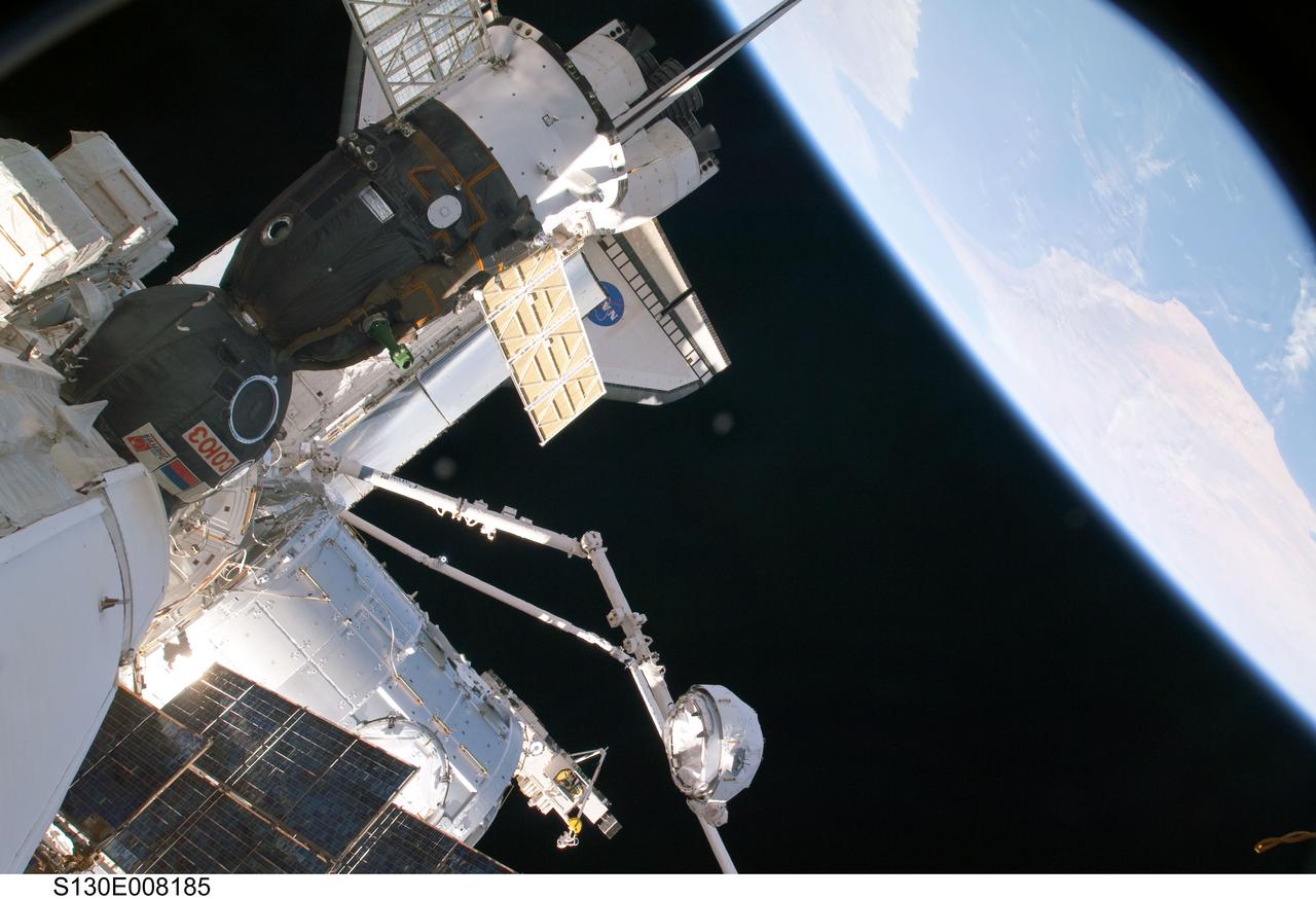 S130-E-008185 (15 Feb. 2010) --- In the grasp of the Canadarm2, the Cupola is relocated from the forward port to the Earth-facing port of the International Space Station’s newly-installed Tranquility node. NASA astronauts Terry Virts, STS-130 pilot; and Kathryn Hire, mission specialist, moved the Cupola, operating the station’s robotic arm from controls inside the Destiny laboratory.