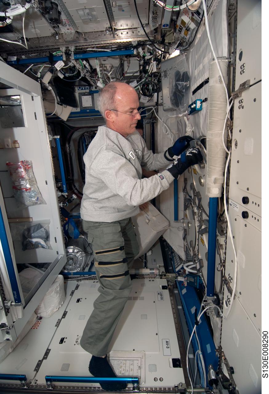 S130-E-008290 (15 Feb. 2010) --- NASA astronaut Jeffrey Williams, Expedition 22 commander, works in the Destiny laboratory of the International Space Station while space shuttle Endeavour (STS-130) remains docked with the station.