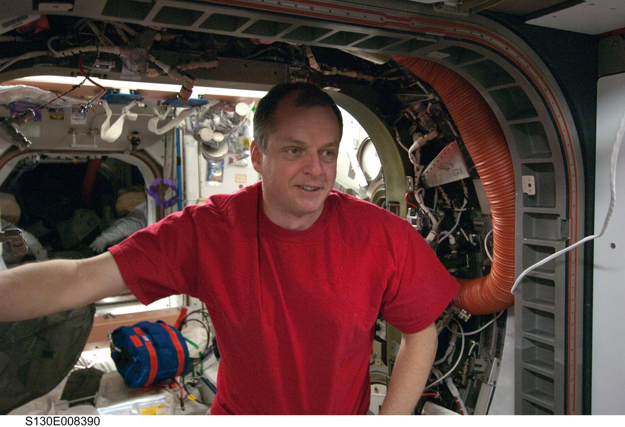 S130-E-008390 (15 Feb. 2010) --- NASA astronaut T.J. Creamer, Expedition 22 flight engineer, is pictured in the vestibule between the Unity and Tranquility nodes of the International Space Station while space shuttle Endeavour (STS-130) remains docked with the station.