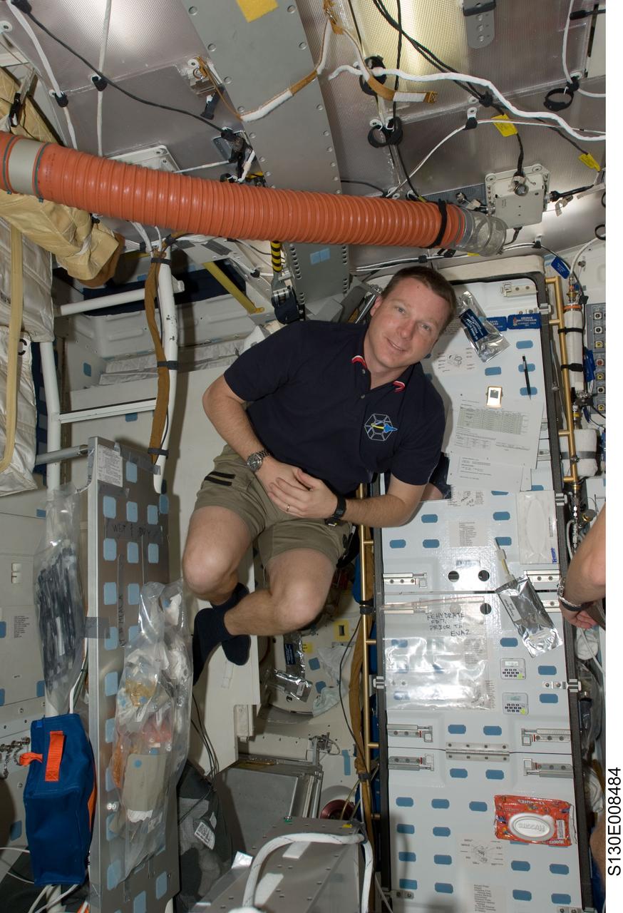 S130-E-008484 (15 Feb. 2010) --- NASA astronaut Terry Virts, STS-130 pilot, floats freely on the middeck of space shuttle Endeavour while docked with the International Space Station.