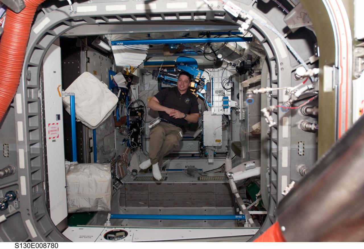 S130-E-008780 (16 Feb. 2010) --- NASA astronaut Robert Behnken, STS-130 mission specialist, poses for a photo while floating freely in the Tranquility node of the International Space Station while space shuttle Endeavour remains docked with the station.