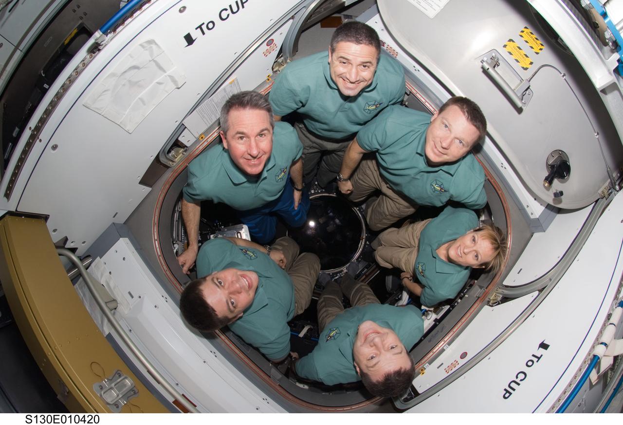 S130-E-010420 (18 Feb. 2010) --- The STS-130 crew members pose for an in-flight crew portrait in the newly-installed Cupola of the International Space Station while space shuttle Endeavour remains docked with the station. Pictured clockwise (from the top) are NASA astronauts George Zamka, commander; Terry Virts, pilot; Kathryn Hire, Nicholas Patrick, Robert Behnken and Stephen Robinson, all mission specialists.
