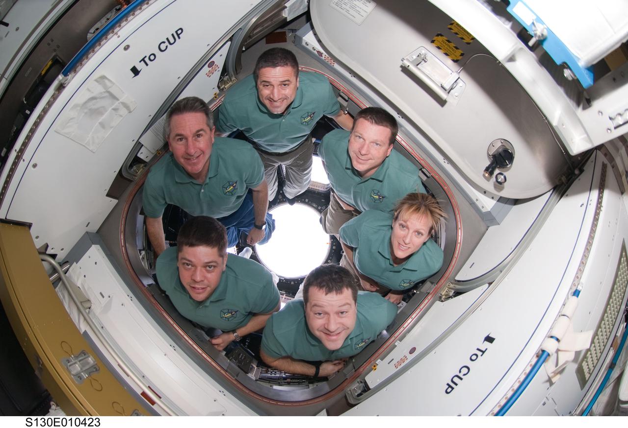S130-E-010423 (18 Feb. 2010) --- The STS-130 crew members pose for an in-flight crew portrait in the newly-installed Cupola of the International Space Station while space shuttle Endeavour remains docked with the station. Pictured clockwise (from the top) are NASA astronauts George Zamka, commander; Terry Virts, pilot; Kathryn Hire, Nicholas Patrick, Robert Behnken and Stephen Robinson, all mission specialists.
