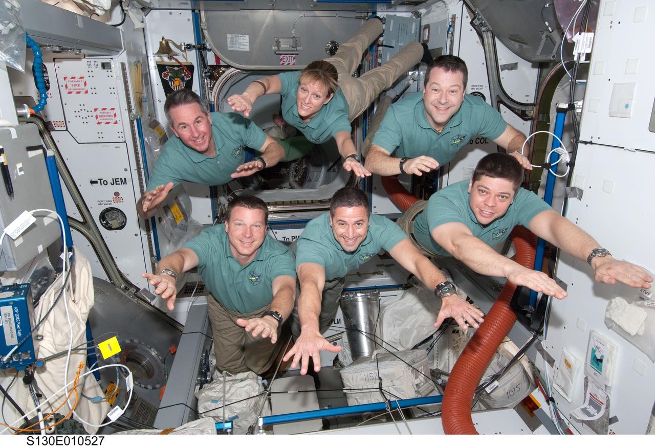 S130-E-010527 (18 Feb. 2010) --- STS-130 crew members pose for a portrait in the Harmony node following a joint crew news conference with the Expedition 22 crew members while space shuttle Endeavour remains docked with the International Space Station. Pictured on the bottom row are NASA astronauts George Zamka (center), commander; Terry Virts (left), pilot; and Robert Behnken, mission specialist. Pictured from the left (top row) are astronauts Stephen Robinson, Kathryn Hire and Nicholas Patrick, all mission specialists.