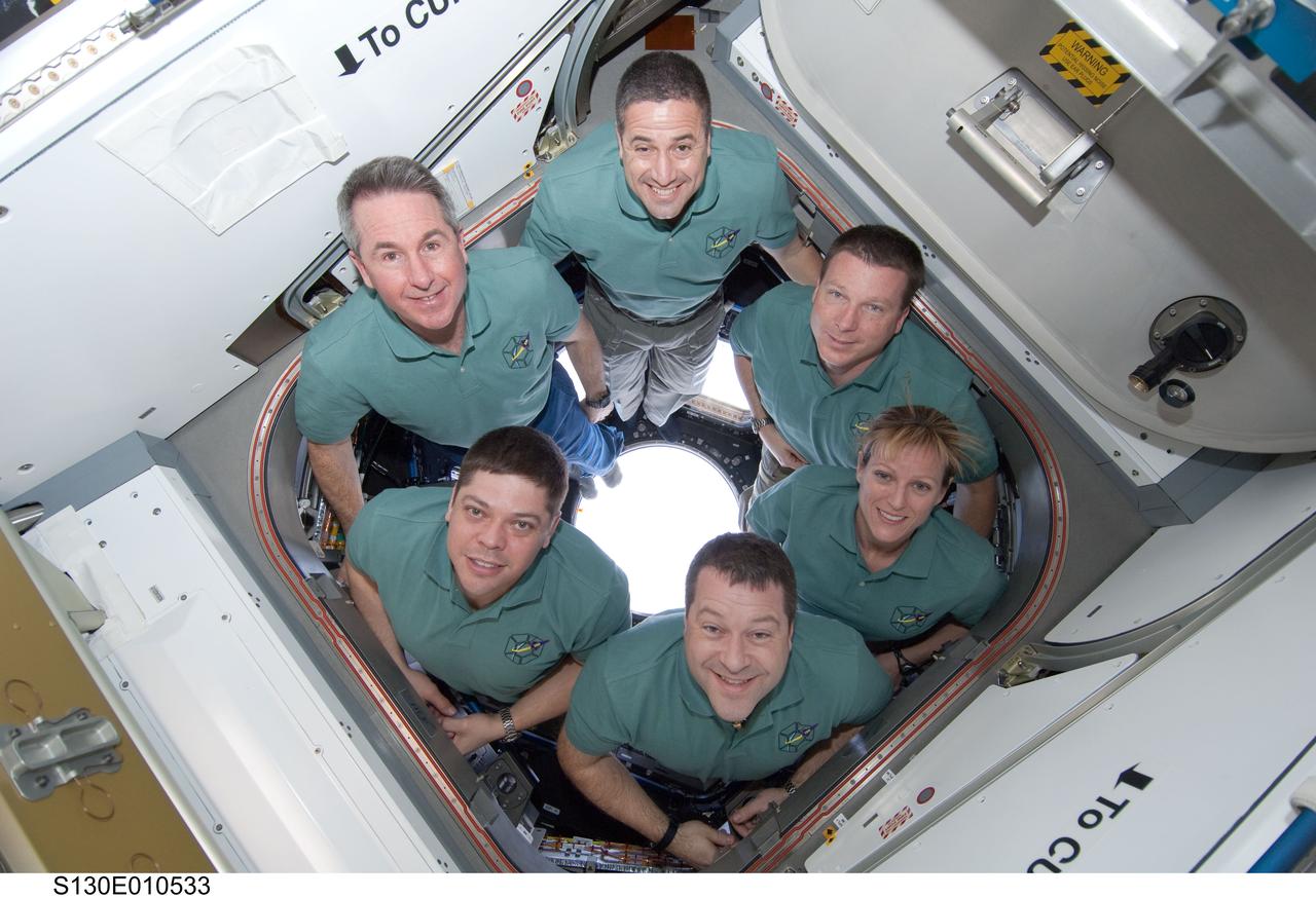 S130-E-010533 (18 Feb. 2010) --- STS-130 crew members pose for a portrait in the Cupola following a joint crew news conference with the Expedition 22 crew members while space shuttle Endeavour remains docked with the International Space Station. Pictured clockwise (from the top) are NASA astronauts George Zamka, commander; Terry Virts, pilot; Kathryn Hire, Nicholas Patrick, Robert Behnken and Stephen Robinson, all mission specialists.