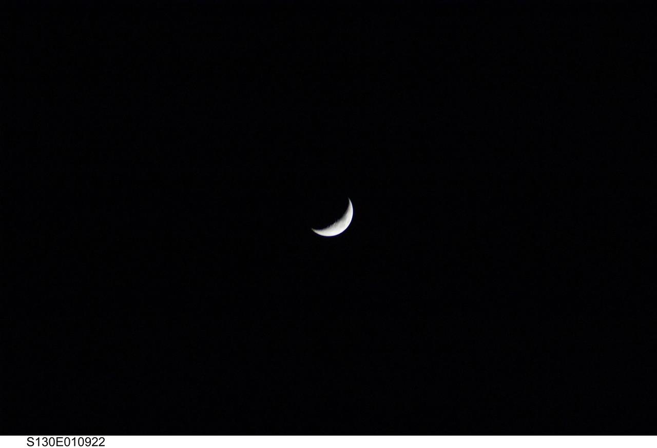 S130-E-010922 (20 Feb. 2010) --- After several days of seeing out-the-window close-up views of the various elements of the International Space Station, the STS-130 crewmembers aboard the space shuttle Endeavour aimed one of their cameras at the waxing crescent moon following separation from the orbital outpost. Eleven astronauts and cosmonauts worked together to continue construction on the orbital outpost and perform other tasks in tandem.