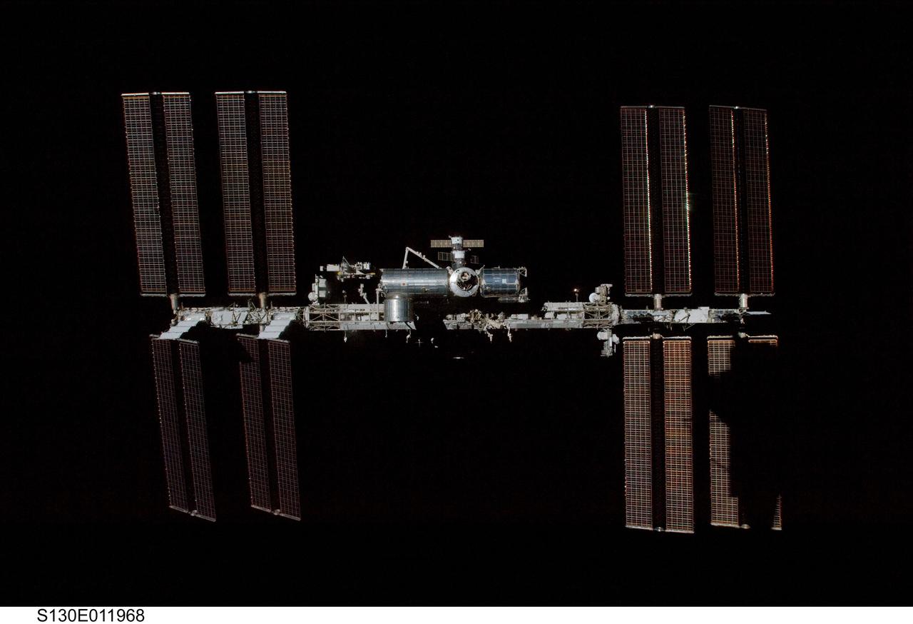 S130-E-011968 (19 Feb. 2010) --- Surrounded by the blackness of space, the International Space Station is featured in this image photographed by an STS-130 crew member on space shuttle Endeavour after the station and shuttle began their post-undocking relative separation. Undocking of the two spacecraft occurred at 7:54 p.m. (EST) on Feb. 19, 2010. A partial shadow of Endeavour is visible on the solar array wing panels at lower right.
