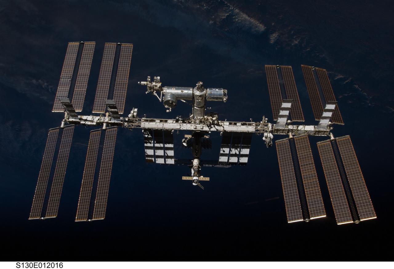 S130-E-012016 (19 Feb. 2010) --- The International Space Station is featured in this image photographed by an STS-130 crew member on space shuttle Endeavour after the station and shuttle began their post-undocking relative separation. Undocking of the two spacecraft occurred at 7:54 p.m. (EST) on Feb. 19, 2010.