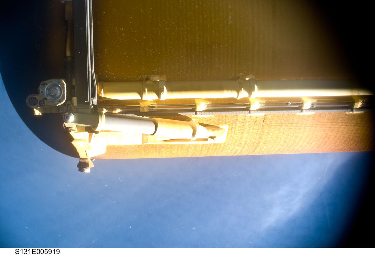 S131-E-005919 (5 April 2010) --- Space shuttle Discovery?s external fuel tank (ET) is featured in this image photographed by the umbilical well camera aboard Discovery shortly after separating from the shuttle following launch.