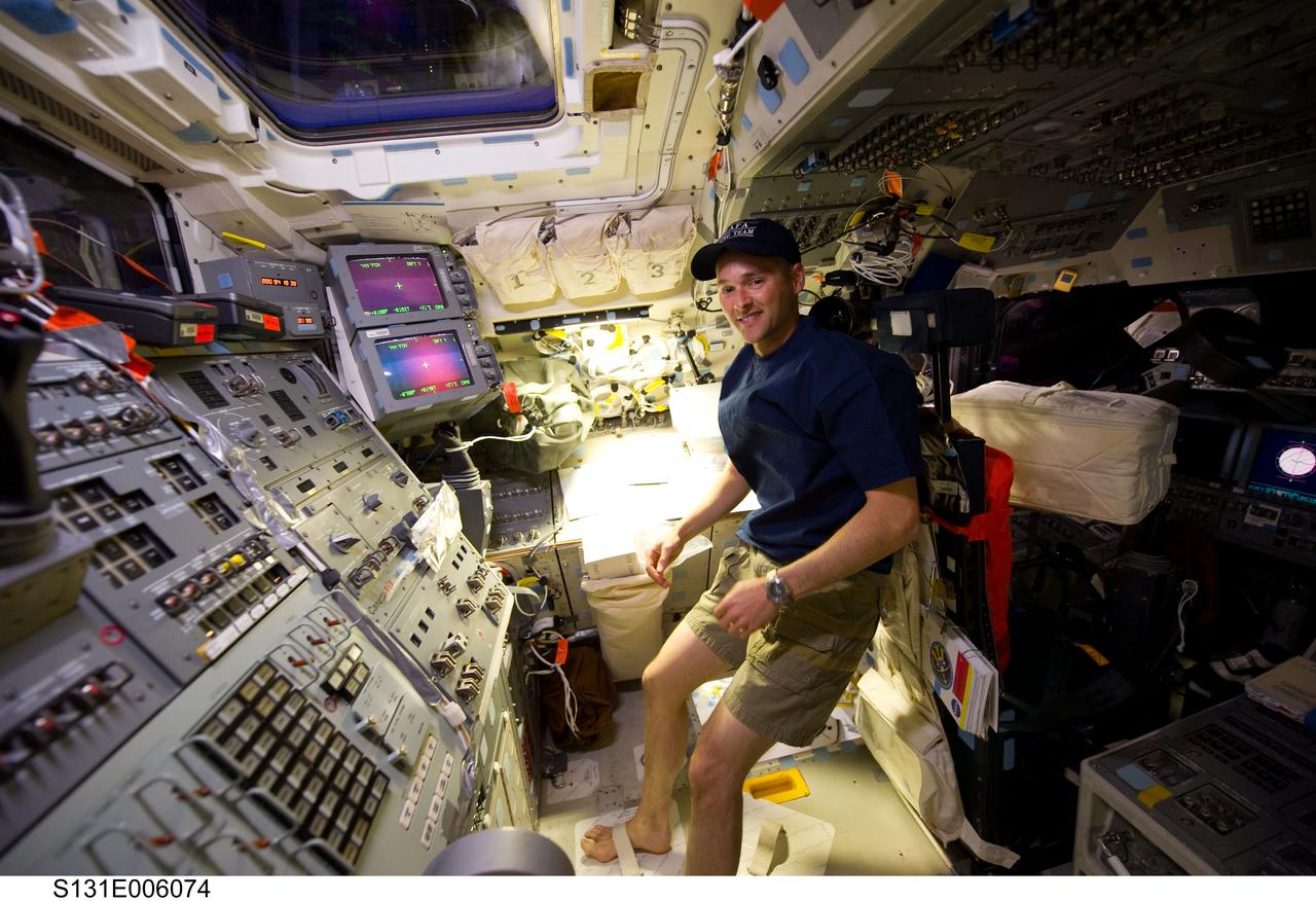 S131-E-006074 (5 April 2010) --- NASA astronaut James P. Dutton Jr., STS-131 pilot, is pictured on the aft flight deck of space shuttle Discovery during flight day one activities.