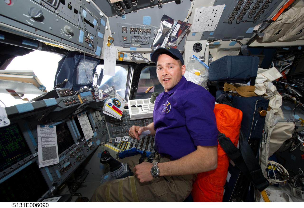 S131-E-006090 (6 April 2010) --- NASA astronaut James P. Dutton Jr., STS-131 pilot, occupies the pilot?s station on the flight deck of space shuttle Discovery during flight day two activities.