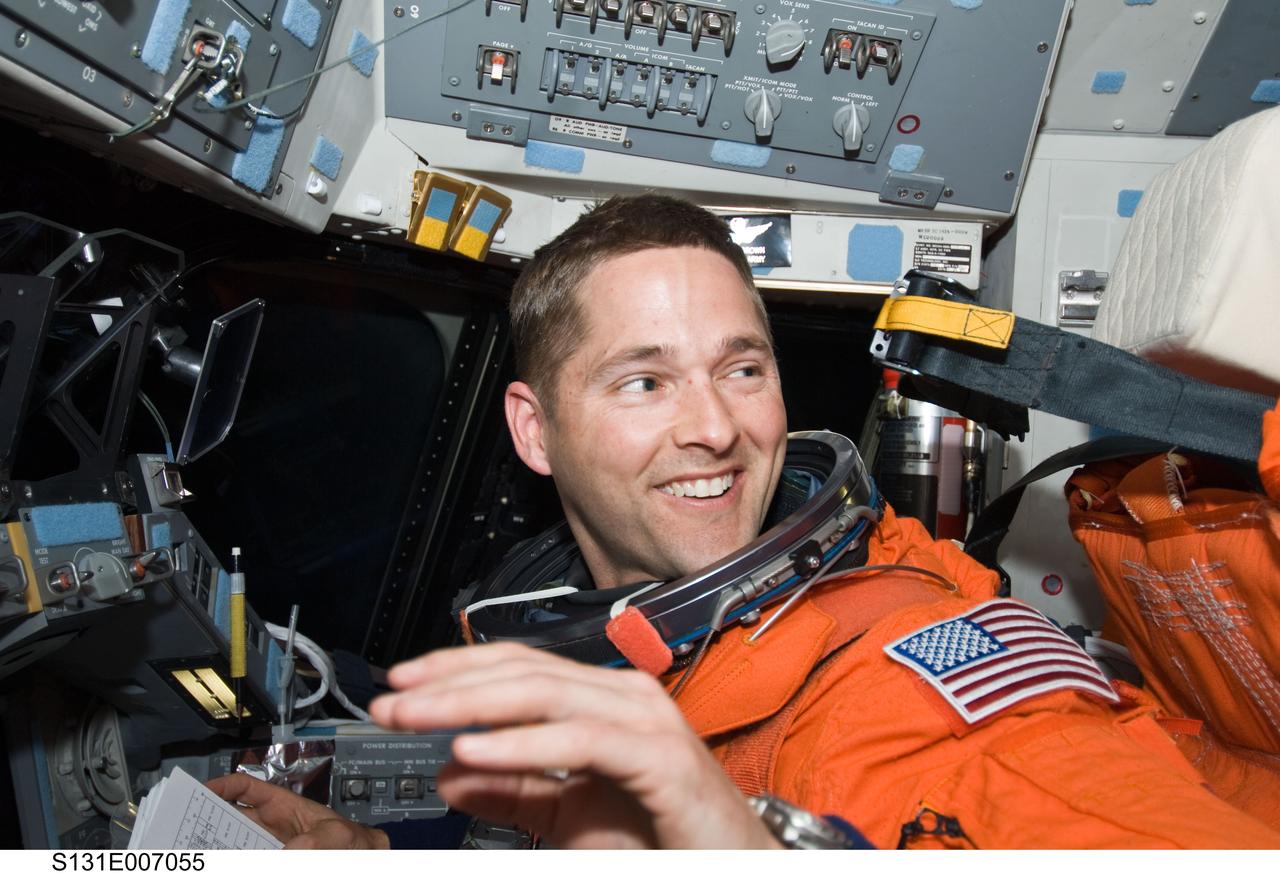 S131-E-007055 (5 April 2010) --- NASA astronaut James P. Dutton Jr., STS-131 pilot, attired in his shuttle launch and entry suit, occupies the pilot?s station on the flight deck of space shuttle Discovery during postlaunch activities.