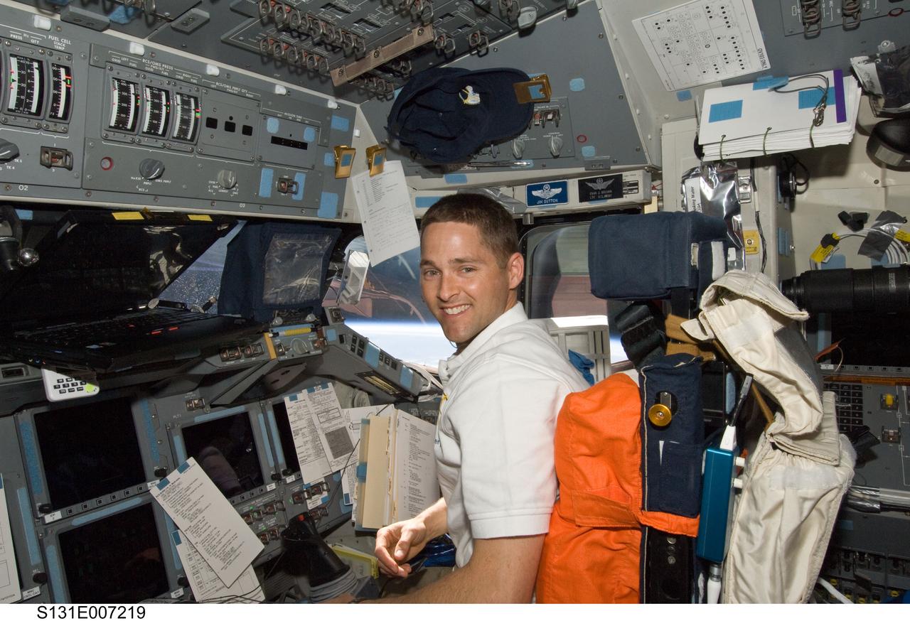 S131-E-007219 (6 April 2010) --- NASA astronaut James P. Dutton Jr., STS-131 pilot, occupies the pilot?s station on the forward flight deck of space shuttle Discovery during flight day three activities.
