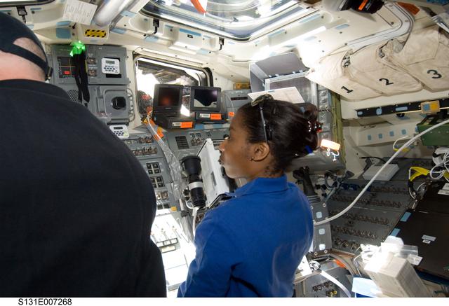 NASA image: Poindexter and Wilson on the Flight Deck during Approach OPS
