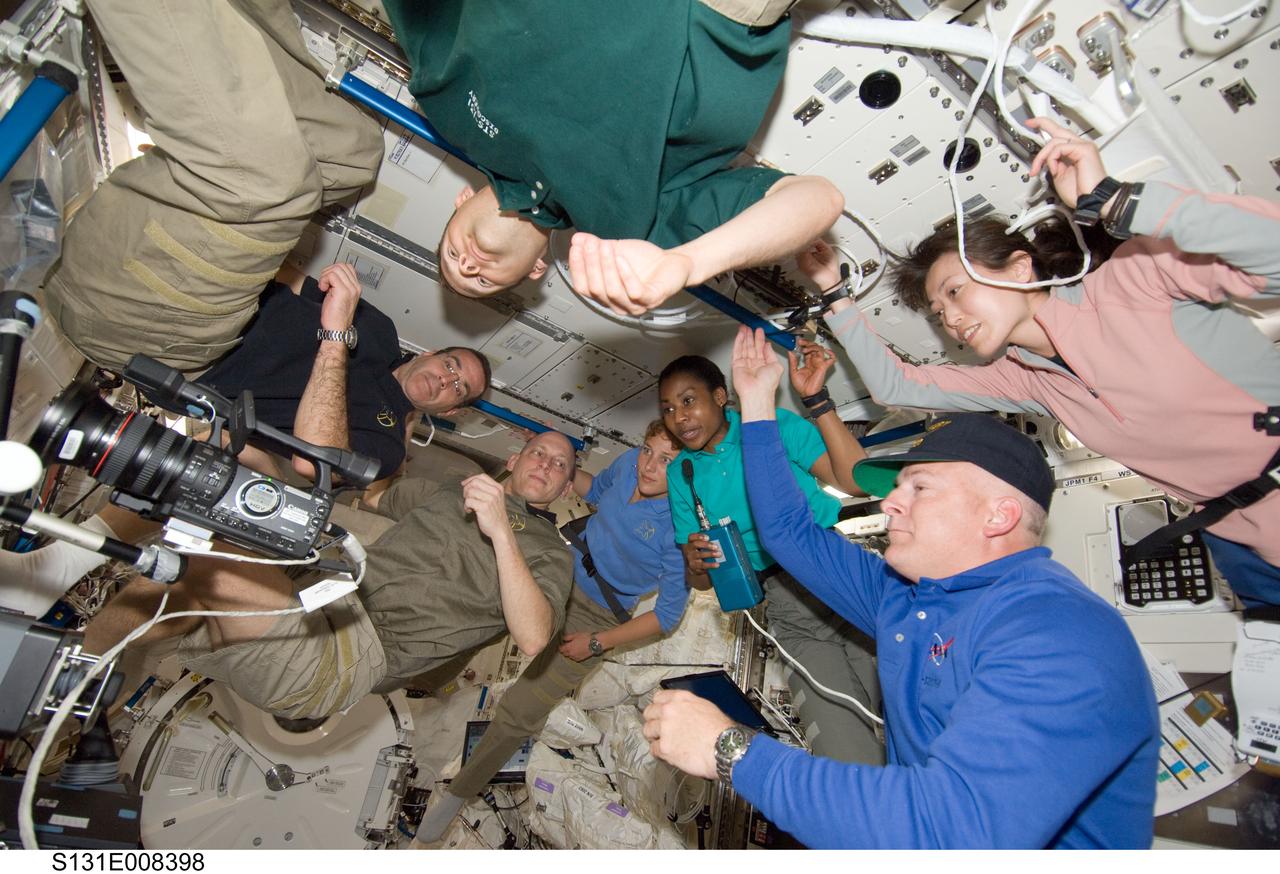 S131-E-008398 (9 April 2010) --- The seven STS-131 crew members -- working guests for several days aboard the International Space Station -- are seen in Japan's Kibo laboratory during a video downlink to the ground. NASA astronaut Alan Poindexter is at bottom right. Others pictured are astronauts James P. Dutton  Jr. (top edge of frame), pilot; and Rick Mastracchio (from far left), Clayton Anderson, Dorothy Metcalf-Lindenburger and Stephanie Wilson, along with Japan's Naoko Yamazaki, all mission specialists.