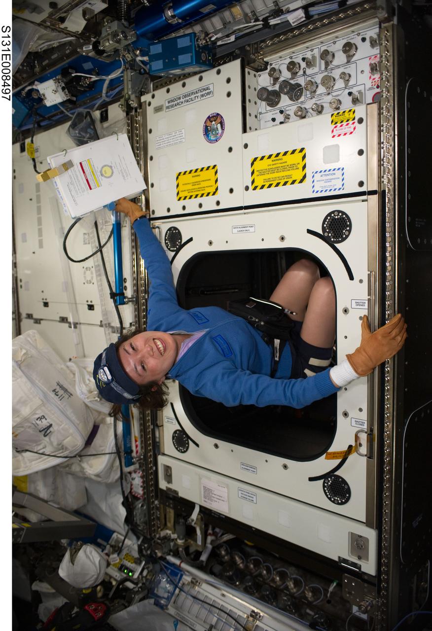 S131-E-008497 (10 April 2010) --- Japan Aerospace Exploration Agency (JAXA) astronaut Naoko Yamazaki, STS-131 mission specialist, works with the Window Observational Research Facility (WORF) in the Destiny laboratory of the International Space Station while space shuttle Discovery remains docked with the station. WORF will provide cameras, multispectral and hyperspectral scanners, camcorders and other instruments to capture Earth imagery through Destiny?s nadir window.