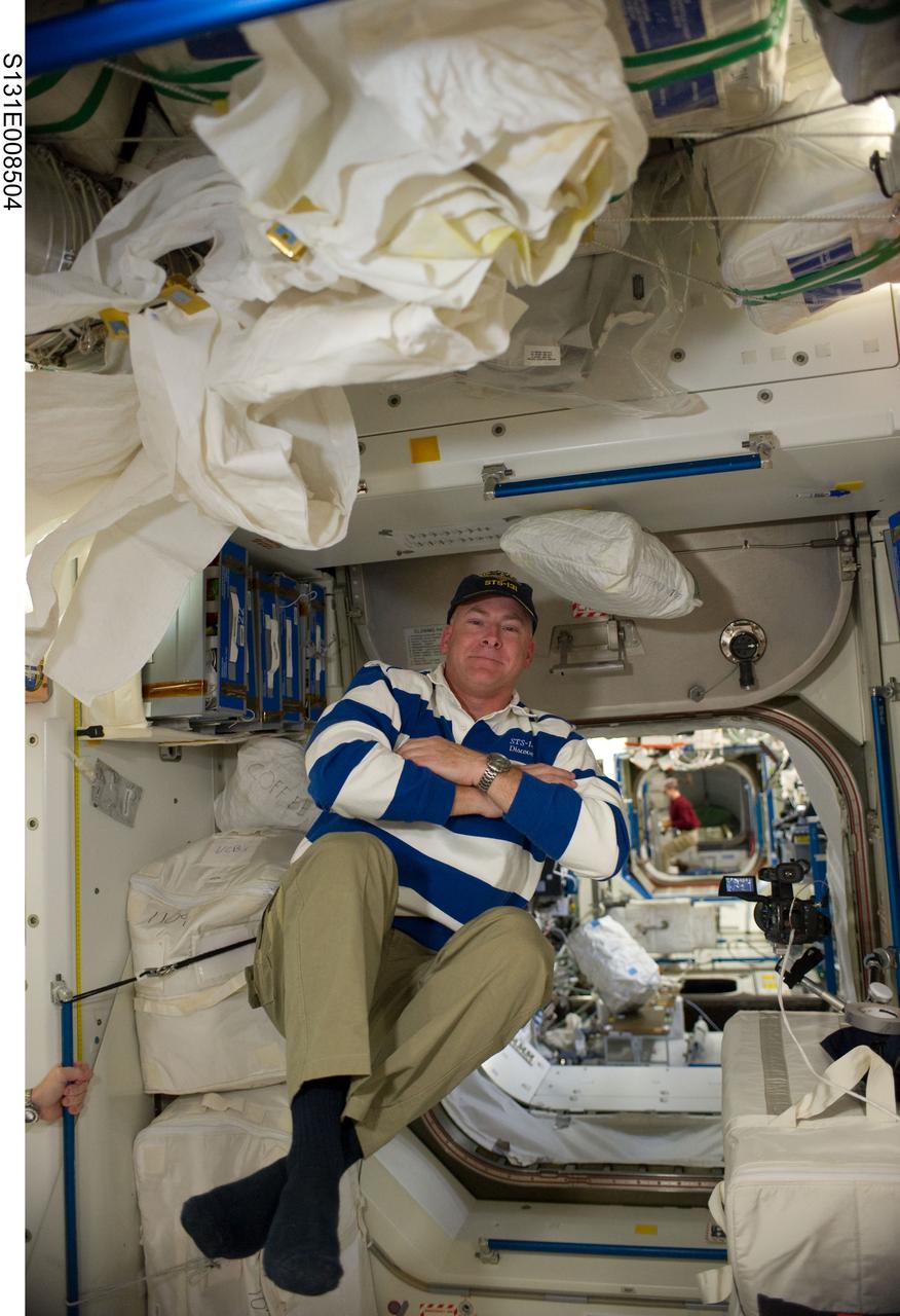 S131-E-008504 (10 April 2010) --- NASA astronaut Alan Poindexter, STS-131 commander, floats freely in the Unity node of the International Space Station while space shuttle Discovery remains docked with the station.