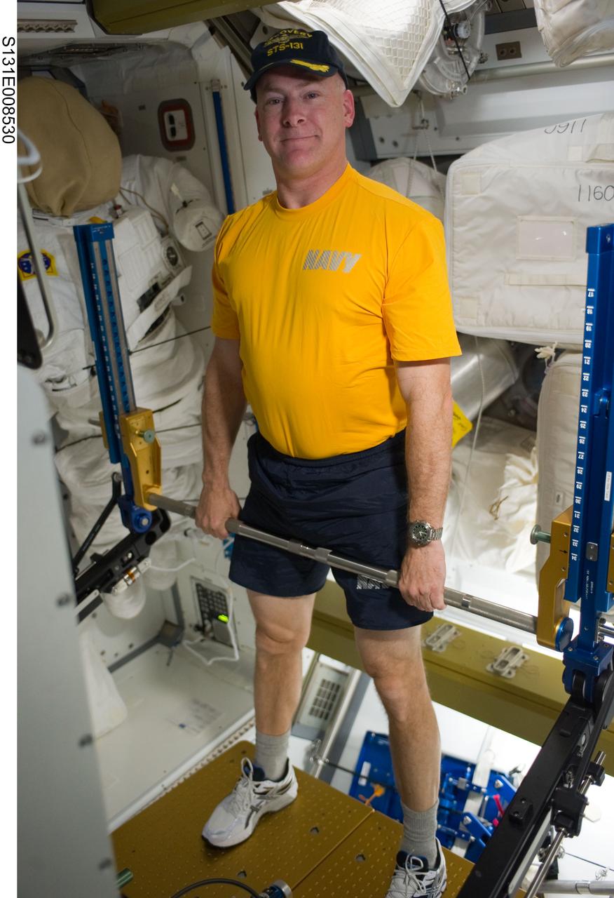 S131-E-008530 (10 April 2010) --- NASA astronaut Alan Poindexter, STS-131 commander, exercises using the advanced Resistive Exercise Device (aRED) in the Tranquility node of the International Space Station while space shuttle Discovery remains docked with the station.