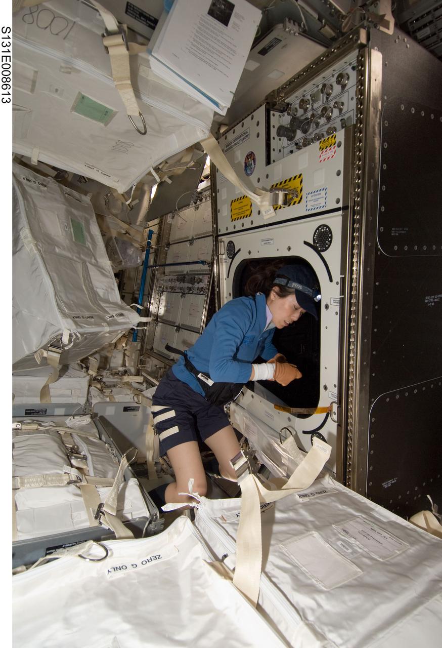 S131-E-008613 (10 April 2010) --- Japan Aerospace Exploration Agency (JAXA) astronaut Naoko Yamazaki, STS-131 mission specialist, works with the Window Observational Research Facility (WORF) in the Destiny laboratory of the International Space Station while space shuttle Discovery remains docked with the station. WORF will provide cameras, multispectral and hyperspectral scanners, camcorders and other instruments to capture Earth imagery through Destiny?s nadir window.