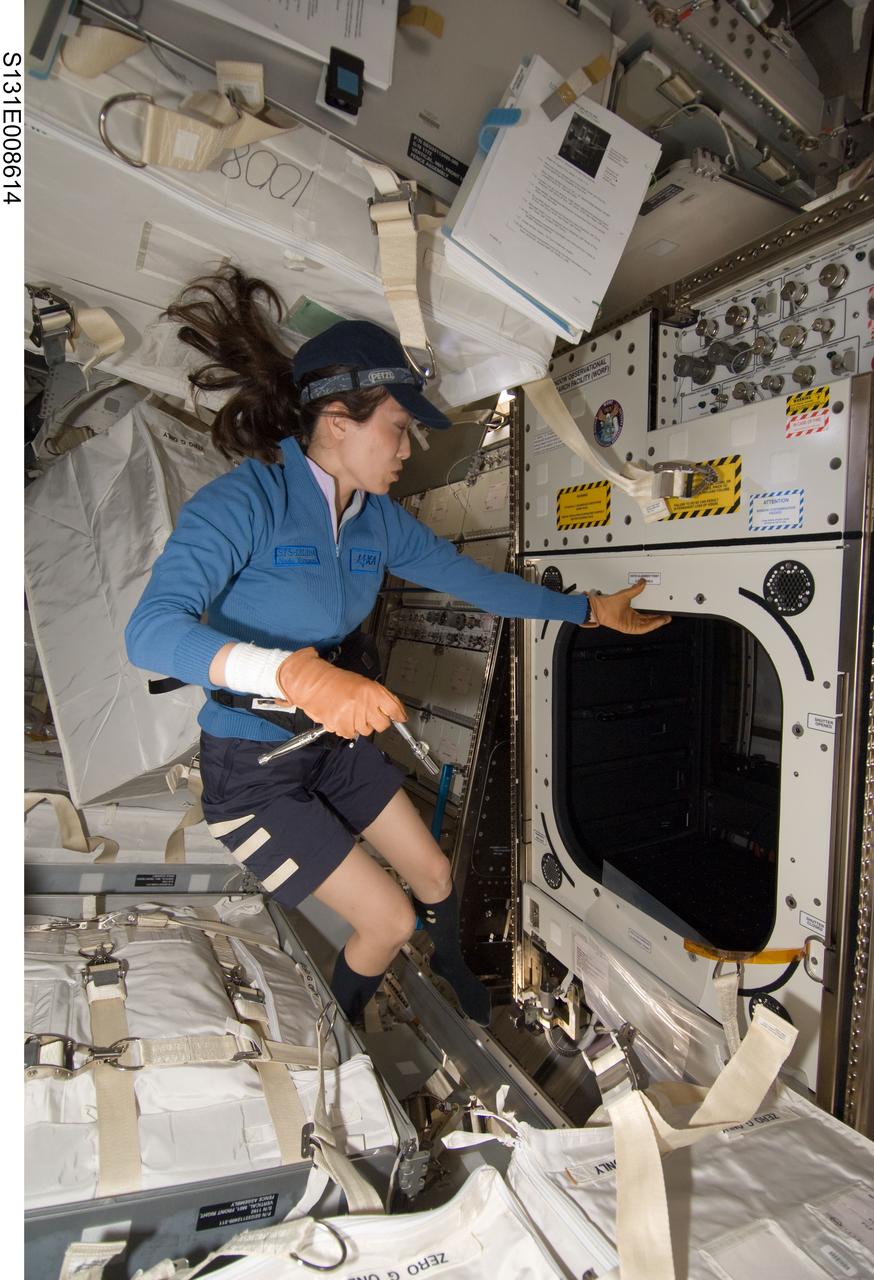 S131-E-008614 (10 April 2010) --- Japan Aerospace Exploration Agency (JAXA) astronaut Naoko Yamazaki, STS-131 mission specialist, works with the Window Observational Research Facility (WORF) in the Destiny laboratory of the International Space Station while space shuttle Discovery remains docked with the station. WORF will provide cameras, multispectral and hyperspectral scanners, camcorders and other instruments to capture Earth imagery through Destiny?s nadir window.