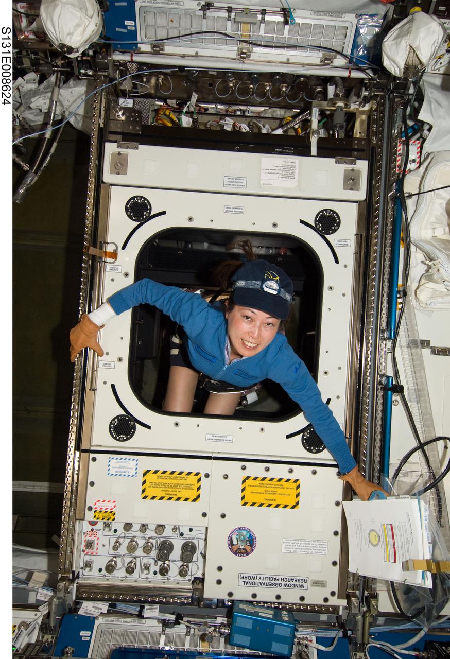 S131-E-008624 (10 April 2010) --- Japan Aerospace Exploration Agency (JAXA) astronaut Naoko Yamazaki, STS-131 mission specialist, works with the Window Observational Research Facility (WORF) in the Destiny laboratory of the International Space Station while space shuttle Discovery remains docked with the station. WORF will provide cameras, multispectral and hyperspectral scanners, camcorders and other instruments to capture Earth imagery through Destiny?s nadir window.