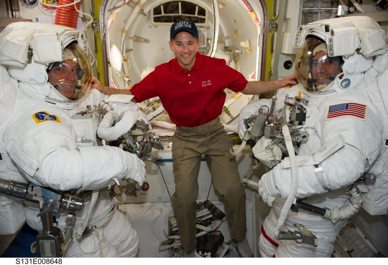 S131-E-008648 (11 April 2010) --- NASA astronauts Clayton Anderson (left) and Rick Mastracchio, both STS-131 mission specialists, attired in their Extravehicular Mobility Unit (EMU) spacesuits; along with astronaut James P. Dutton Jr., pilot, are pictured in the Quest airlock of the International Space Station prior to the start of the mission's second spacewalk.