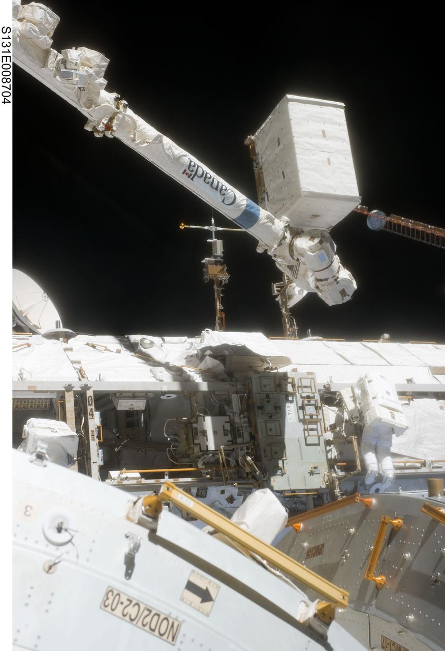 S131-E-008704 (11 April 2010) --- NASA astronaut Clayton Anderson, STS-131 mission specialist, participates in the mission's second session of extravehicular activity (EVA) as construction and maintenance continue on the International Space Station. During the seven-hour, 26-minute spacewalk, Anderson and Rick Mastracchio (out of frame), mission specialist, unhooked and removed the depleted ammonia tank and installed a 1,700-pound ammonia tank on the station?s Starboard 1 truss, completing the second of a three-spacewalk coolant tank replacement process.