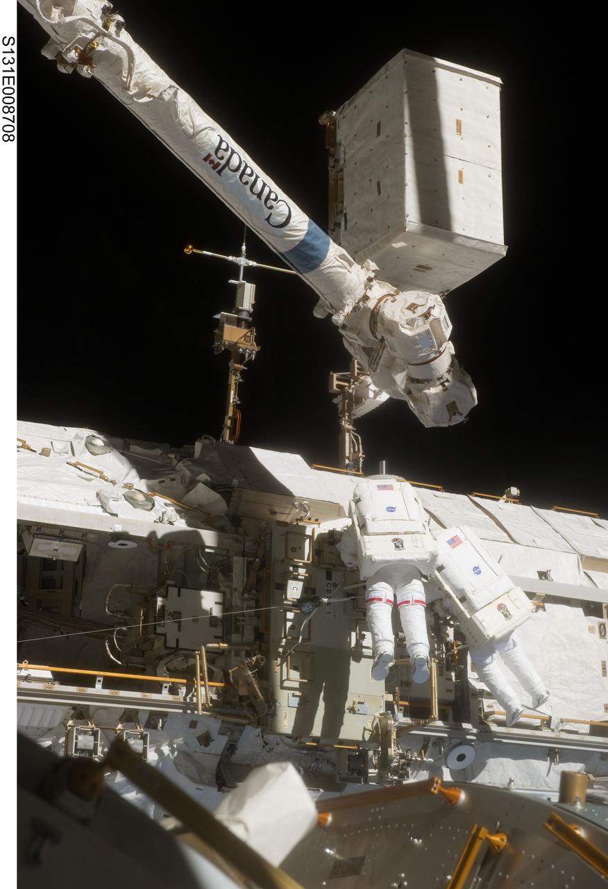 S131-E-008708 (11 April 2010) --- NASA astronaut Rick Mastracchio (left) and Clayton Anderson, both STS-131 mission specialists, participate in the mission's second session of extravehicular activity (EVA) as construction and maintenance continue on the International Space Station. During the seven-hour, 26-minute spacewalk, Mastracchio and Anderson unhooked and removed the depleted ammonia tank and installed a 1,700-pound ammonia tank on the station?s Starboard 1 truss, completing the second of a three-spacewalk coolant tank replacement process.