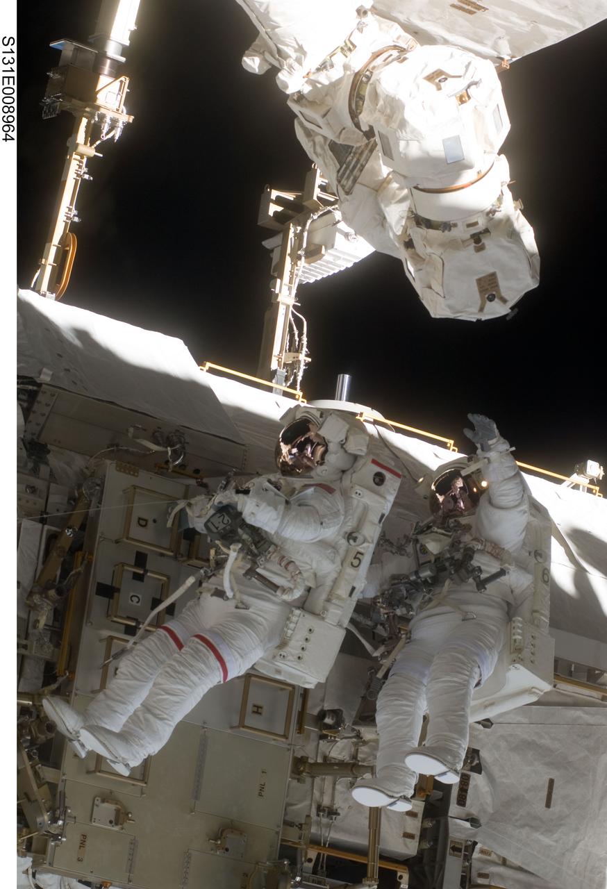 S131-E-008964 (11 April 2010) --- NASA astronauts Rick Mastracchio (left) and Clayton Anderson, both STS-131 mission specialists, participate in the mission's second session of extravehicular activity (EVA) as construction and maintenance continue on the International Space Station. During the seven-hour, 26-minute spacewalk, Mastracchio and Anderson unhooked and removed the depleted ammonia tank and installed a 1,700-pound ammonia tank on the station?s Starboard 1 truss, completing the second of a three-spacewalk coolant tank replacement process.