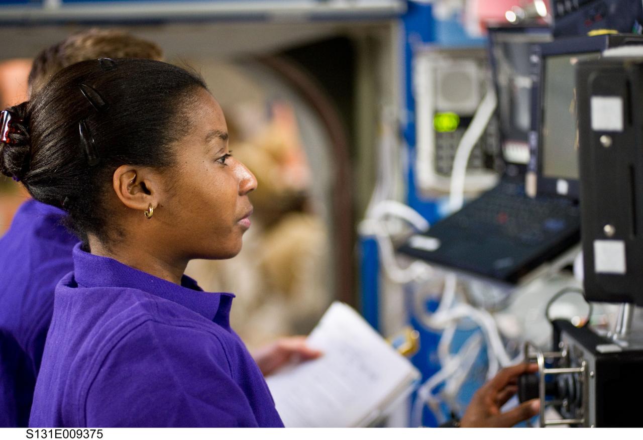 View of Stephanie Wilson as she works at the Robotics Workstation (RWS) in US Laboratory Destiny as she conducts a Space Station Remote Manipulator System (SSRMS) Ammonia Tank Assembly (ATA) retrieval in support of STS-131 EVA 3.