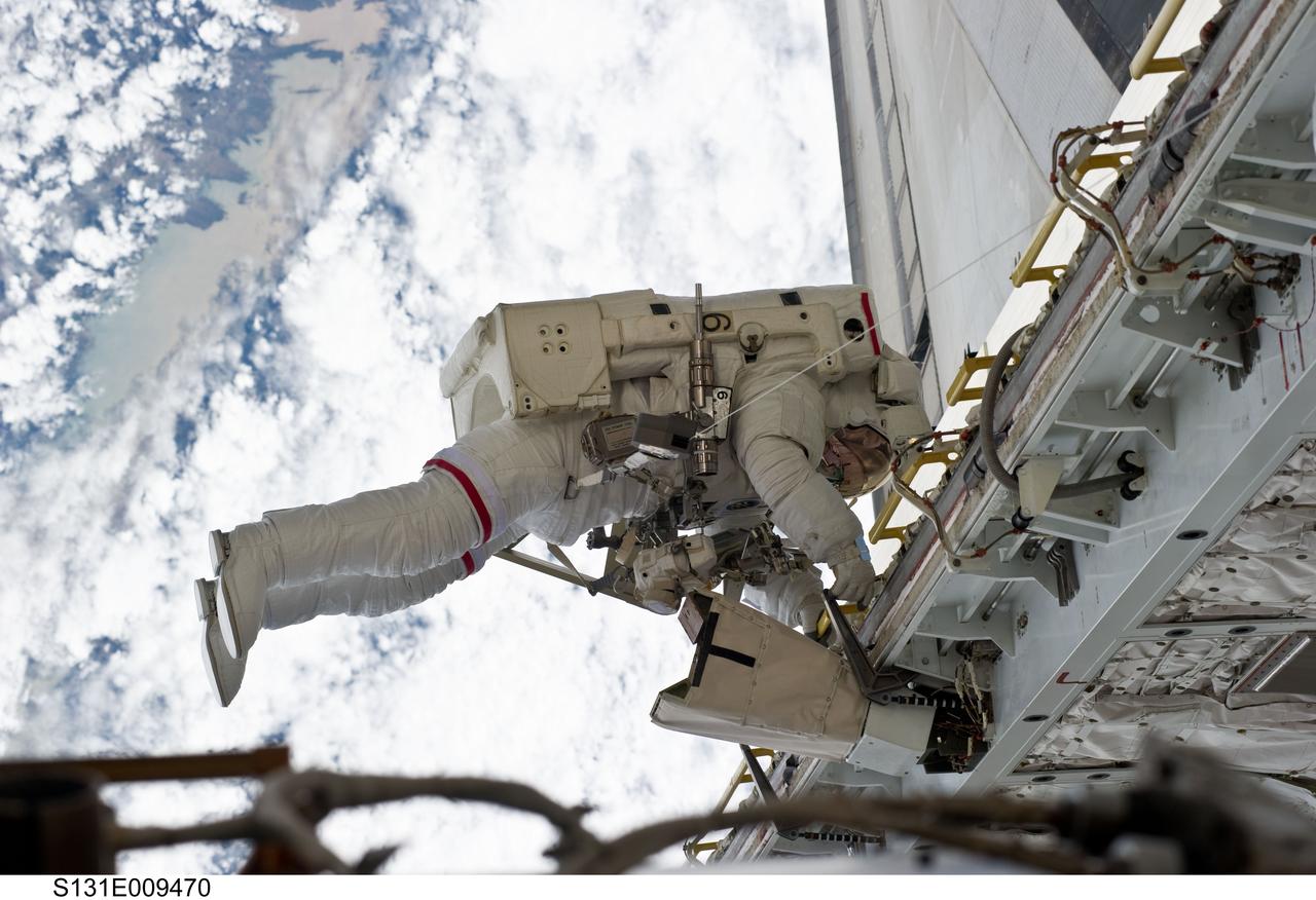 S131-E-009470 (13 April 2010) --- NASA astronaut Rick Mastracchio, STS-131 mission specialist, participates in the mission's third and final session of extravehicular activity (EVA) as construction and maintenance continue on the International Space Station. During the six-hour, 24-minute spacewalk, Mastracchio and astronaut Clayton Anderson (out of frame), mission specialist, hooked up fluid lines of the new 1,700-pound tank, retrieved some micrometeoroid shields from the Quest airlock’s exterior, relocated a portable foot restraint and prepared cables on the Zenith 1 truss for a spare Space to Ground Ku-Band antenna, two chores required before space shuttle Atlantis' STS-132/ULF-4 mission in May.