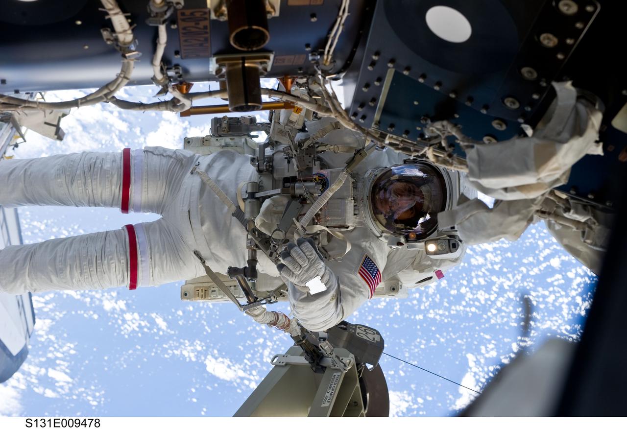 S131-E-009478 (13 April 2010) --- NASA astronaut Rick Mastracchio, STS-131 mission specialist, participates in the mission's third and final session of extravehicular activity (EVA) as construction and maintenance continue on the International Space Station. During the six-hour, 24-minute spacewalk, Mastracchio and astronaut Clayton Anderson (out of frame), mission specialist, hooked up fluid lines of the new 1,700-pound tank, retrieved some micrometeoroid shields from the Quest airlock’s exterior, relocated a portable foot restraint and prepared cables on the Zenith 1 truss for a spare Space to Ground Ku-Band antenna, two chores required before space shuttle Atlantis' STS-132/ULF-4 mission in May.