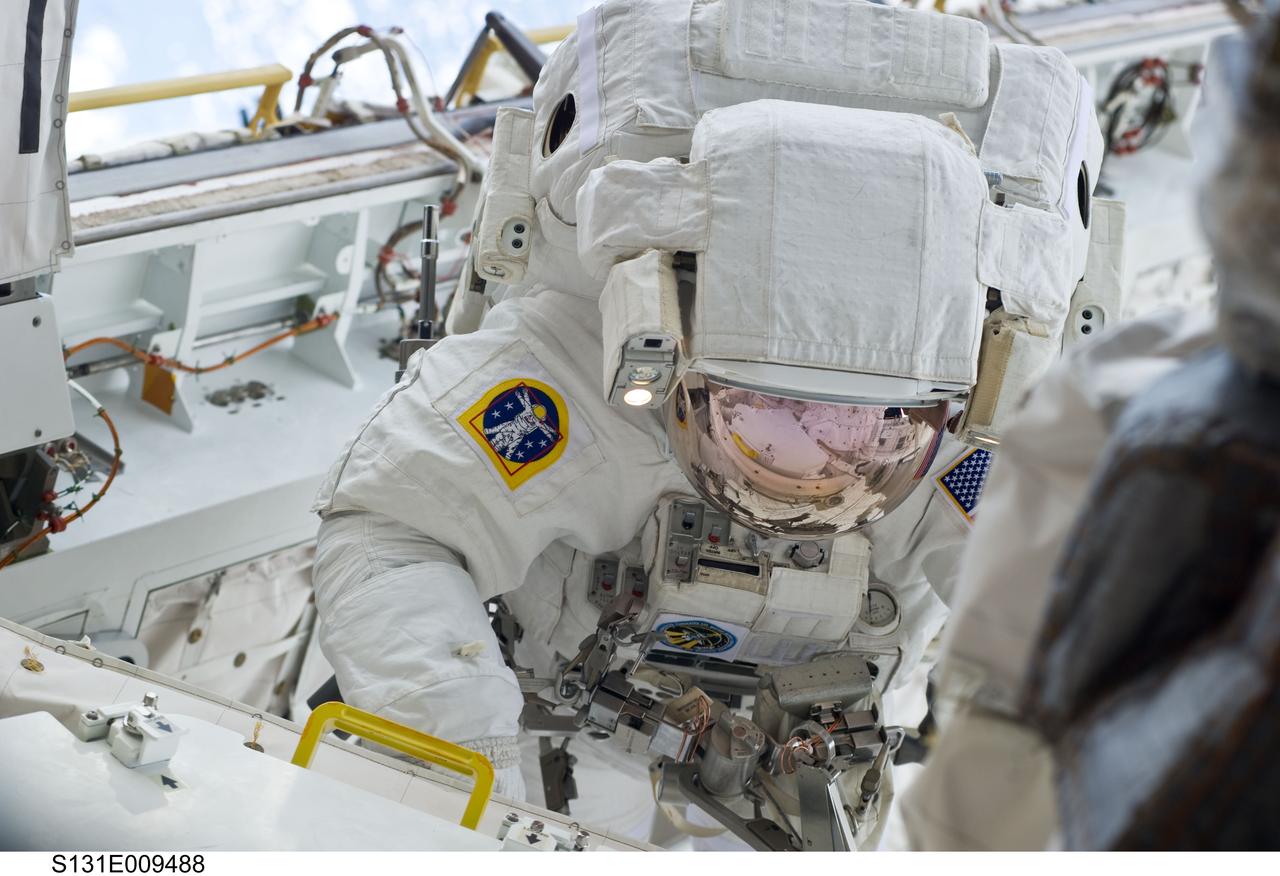 S131-E-009488 (13 April 2010) --- NASA astronaut Clayton Anderson, STS-131 mission specialist, participates in the mission's third and final session of extravehicular activity (EVA) as construction and maintenance continue on the International Space Station. During the six-hour, 24-minute spacewalk, Anderson and astronaut Rick Mastracchio (out of frame), mission specialist, hooked up fluid lines of the new 1,700-pound tank, retrieved some micrometeoroid shields from the Quest airlock’s exterior, relocated a portable foot restraint and prepared cables on the Zenith 1 truss for a spare Space to Ground Ku-Band antenna, two chores required before space shuttle Atlantis' STS-132/ULF-4 mission in May.