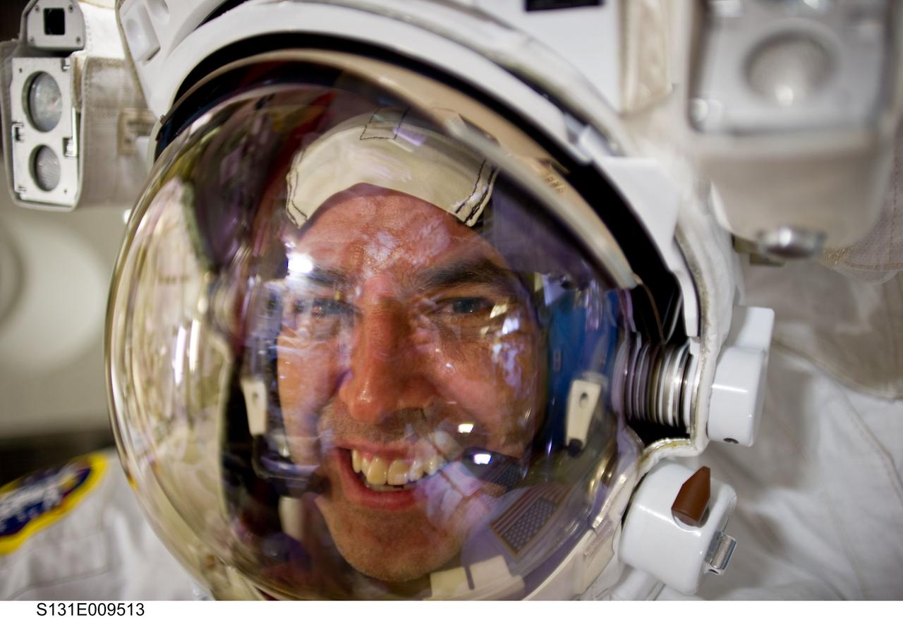 S131-E-009513 (13 April 2010) --- NASA astronaut Rick Mastracchio, STS-131 mission specialist, is pictured in the Quest airlock of the International Space Station as the mission’s third and final spacewalk draws to a close.