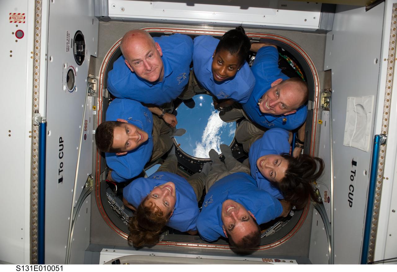 S131-E-010051 (14 April 2010) --- The STS-131 crew members pose for a portrait in the Cupola of the International Space Station while space shuttle Discovery remains docked with the station. Pictured counter-clockwise (from top left) are NASA astronauts Alan Poindexter, commander; James P. Dutton Jr., pilot; Dorothy Metcalf-Lindenburger, Rick Mastracchio, Japan Aerospace Exploration Agency (JAXA) astronaut Naoko Yamazaki, NASA astronauts Clayton Anderson and Stephanie Wilson, all mission specialists.