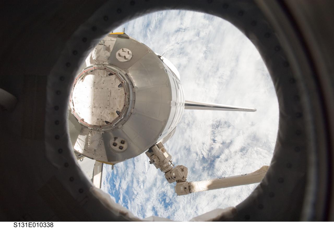 S131-E-010338 (16 April 2010) --- In the grasp of the International Space Station's Canadarm2 robotic arm, the Leonardo Multi-Purpose Logistics Module is placed back in space shuttle Discovery's payload bay. NASA astronaut Stephanie Wilson and Japan Aerospace Exploration Agency (JAXA) astronaut Naoko Yamazaki, both STS-131 mission specialists, were at the controls of the robotic arm in the Destiny laboratory. They grappled Leonardo and removed it from the Harmony node and placed it inside the shuttle's payload bay for the return home.