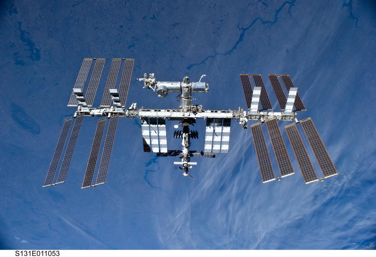 S131-E-011053 (17 April 2010) --- The International Space Station is featured in this image photographed by an STS-131 crew member on space shuttle Discovery after the station and shuttle began their post-undocking relative separation. Undocking of the two spacecraft occurred at 7:52 a.m. (CDT) on April 17, 2010.