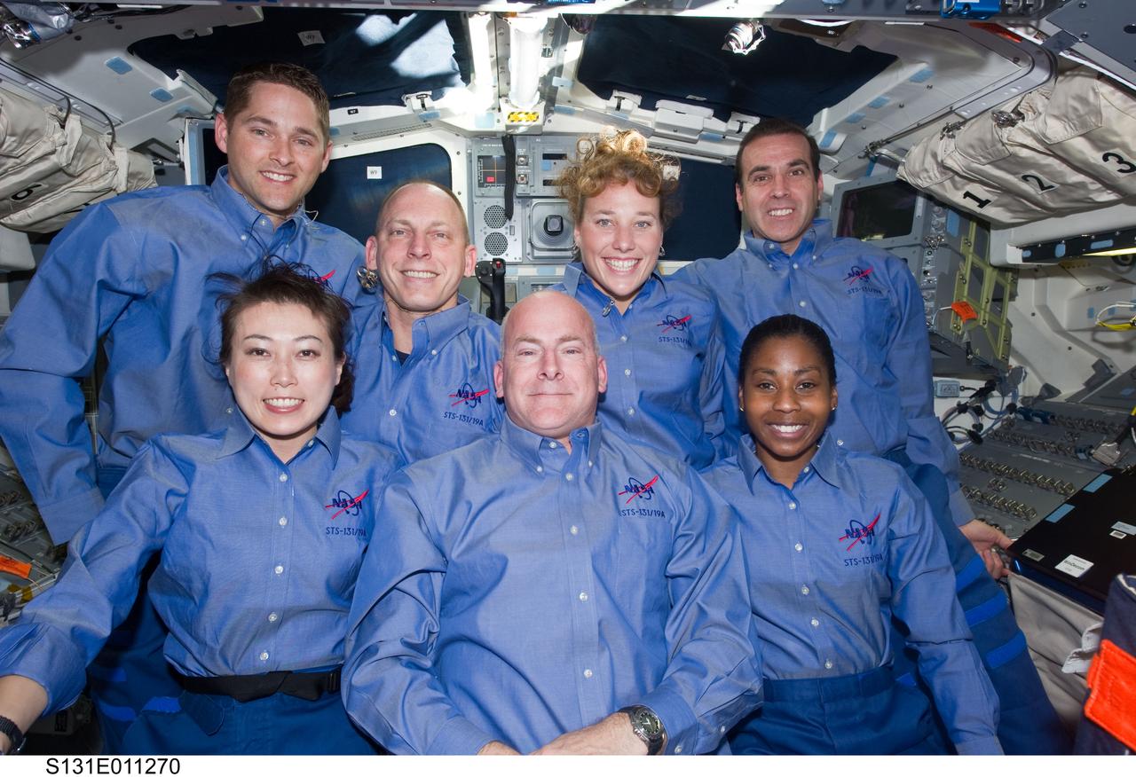 S131-E-011270 (18 April 2010) --- The STS-131 crew members pose for an in-flight portrait on the aft flight deck of the Earth-orbiting space shuttle Discovery. Pictured on the front row are NASA astronaut Alan Poindexter, commander; Japan Aerospace Exploration Agency (JAXA) astronaut Naoko Yamazaki (left) and NASA astronaut Stephanie Wilson, both mission specialists. Pictured from the left (back row) are NASA astronauts James P. Dutton Jr., pilot; Clayton Anderson, Dorothy Metcalf-Lindenburger and Rick Mastracchio, all mission specialists.