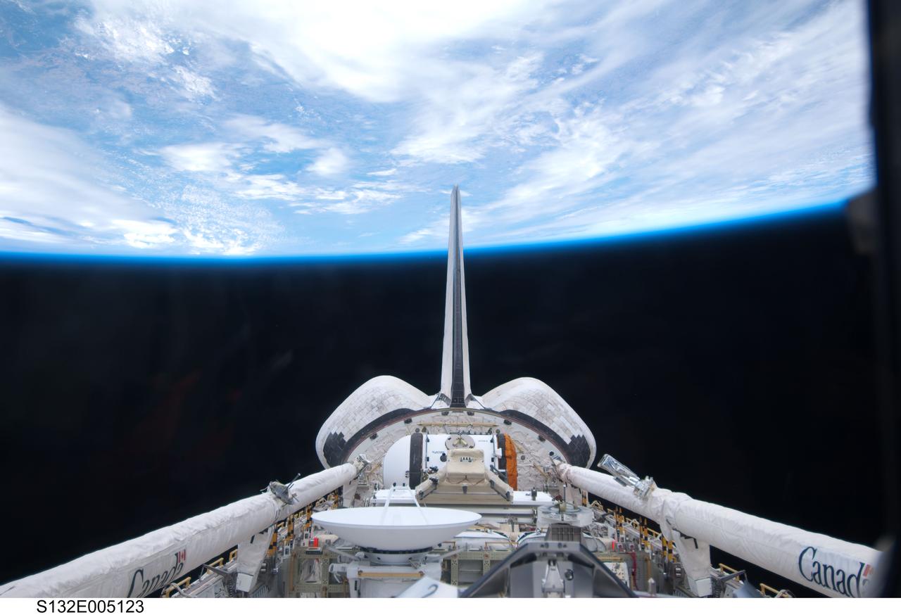 S132-E-005123 (14 May 2010) --- This photograph of space shuttle Atlantis' cargo bay and its vertical stabilizer intersecting Earth's horizon was provided on Flight Day 2 by one of the six STS-132 crew members. The photo was among the initial batch of non-engineering photography downlinked from the Earth-orbiting spacecraft on its final scheduled mission.