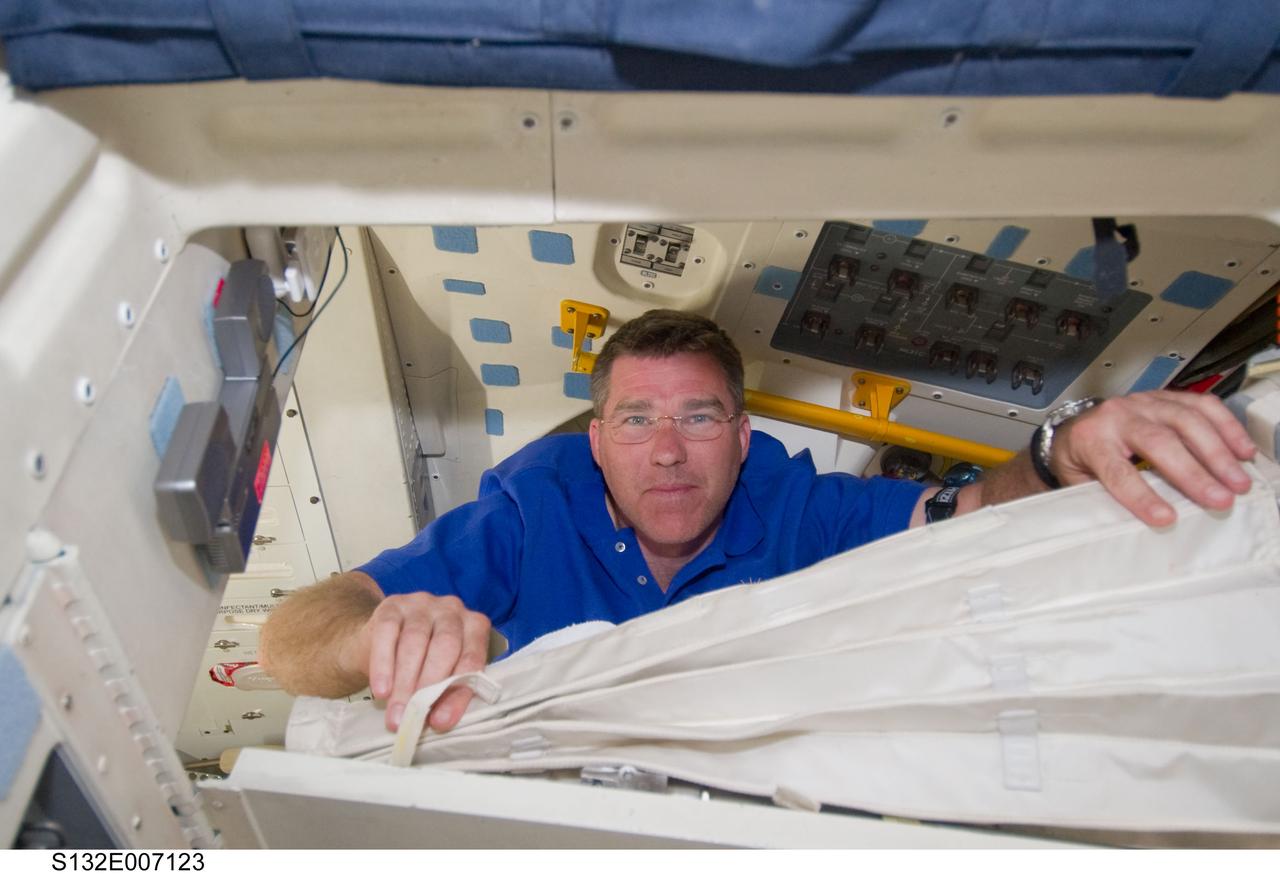 S132-E-007123 (15 May 2010) --- NASA astronaut Steve Bowen, STS-132 mission specialist, is pictured on the middeck of the Earth-orbiting space shuttle Atlantis during flight day two activities.