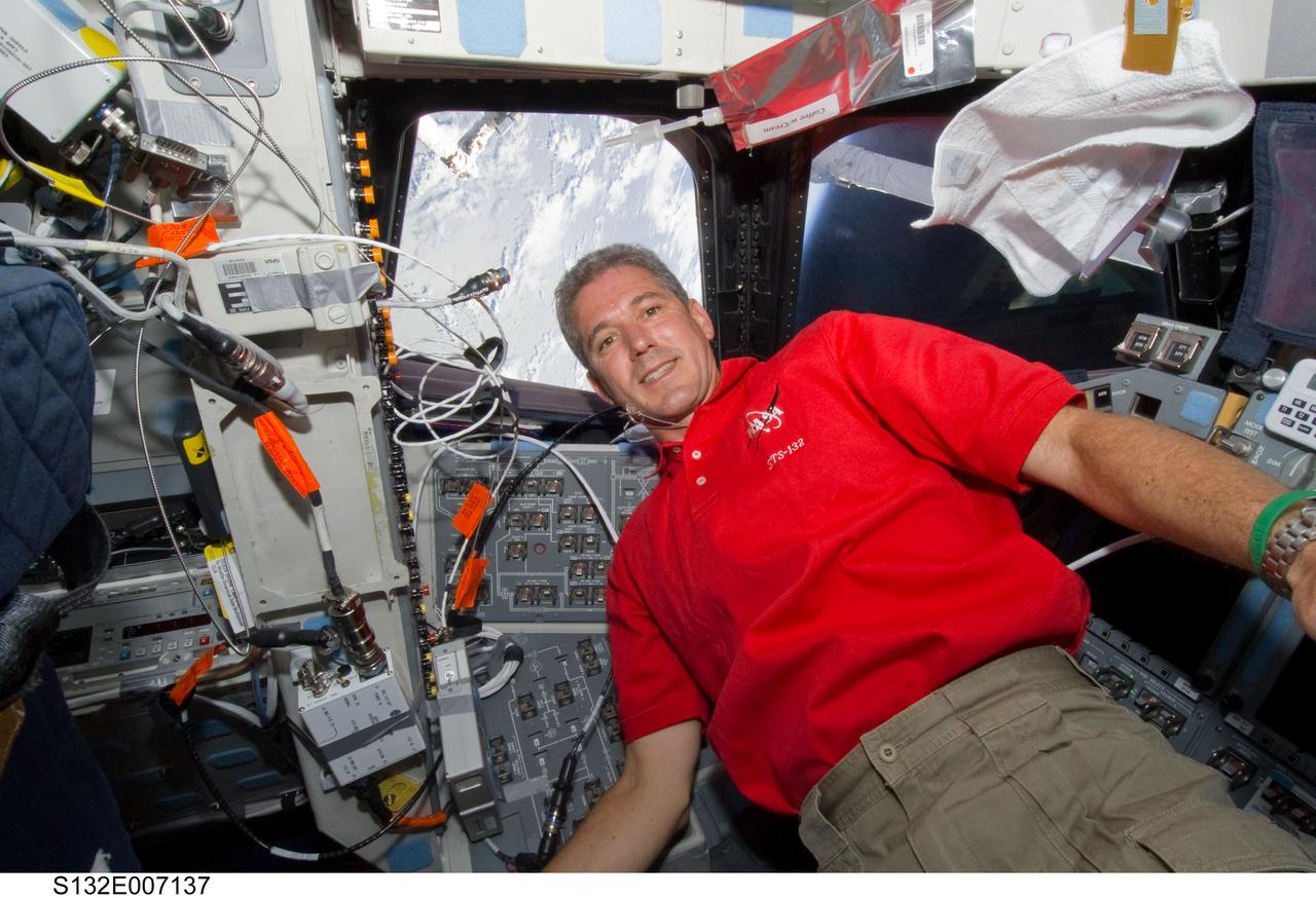 S132-E-007137 (15 May 2010) --- NASA astronaut Michael Good, STS-132 mission specialist, is pictured on the aft flight deck of the Earth-orbiting space shuttle Atlantis during flight day two activities.