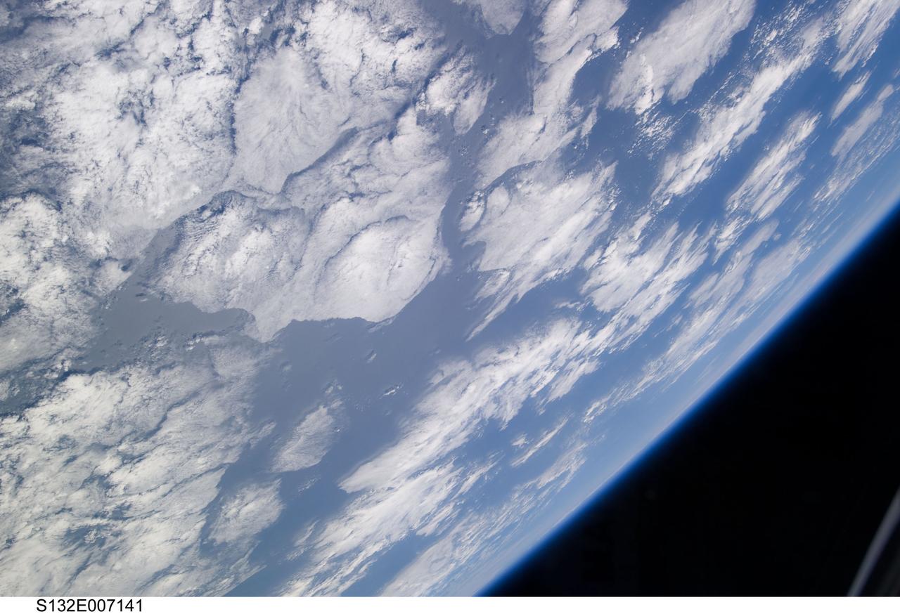 S132-E-007141 (15 May 2010) --- A blue and white part of Earth and the blackness of space are featured in this image photographed by an STS-132 crew member on the Earth-orbiting space shuttle Atlantis during flight day two activities.