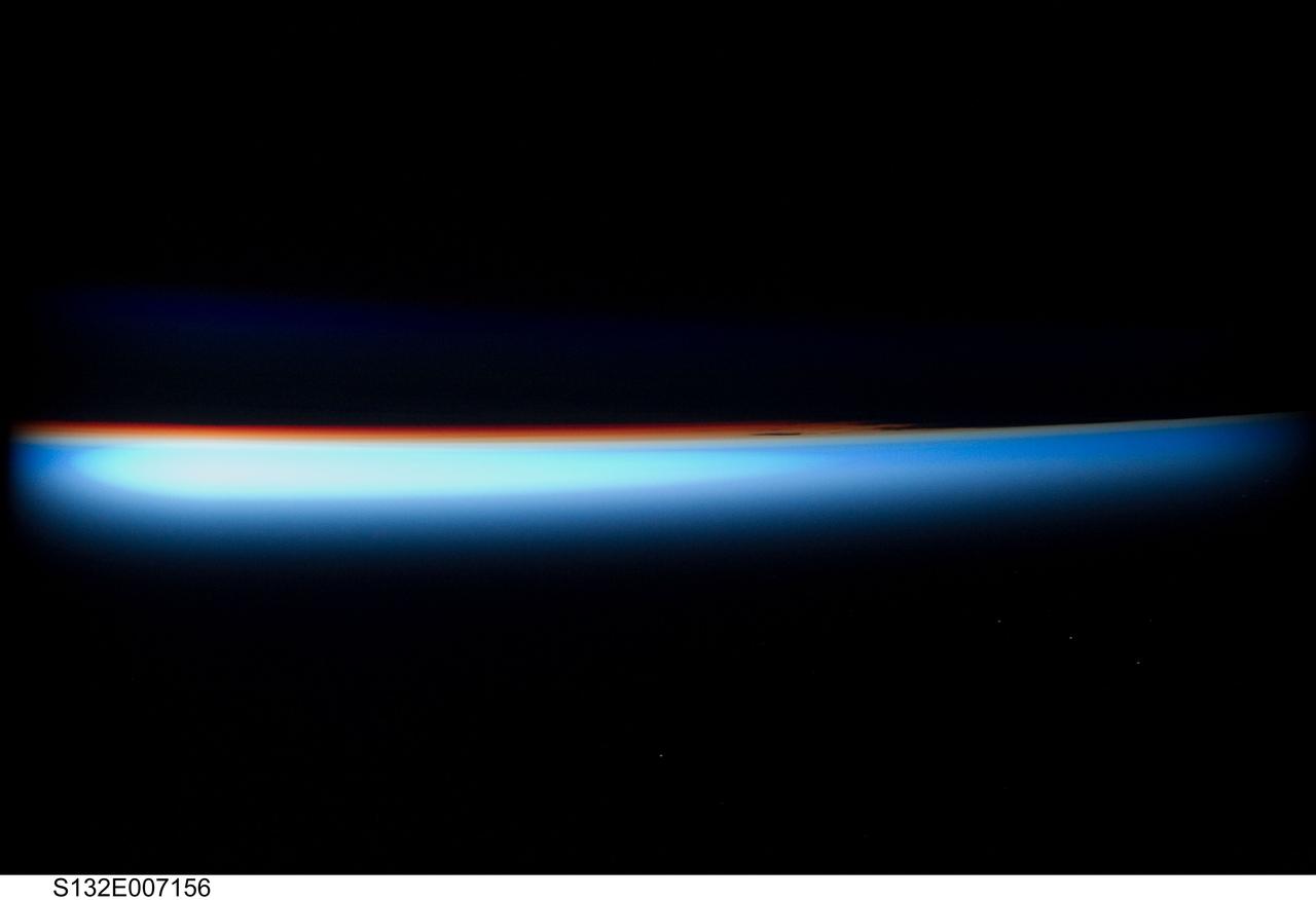 S132-E-007156 (15 May 2010) --- The thin line of Earth's atmosphere and the setting sun are featured in this image photographed by an STS-132 crew member on the Earth-orbiting space shuttle Atlantis during flight day two activities.