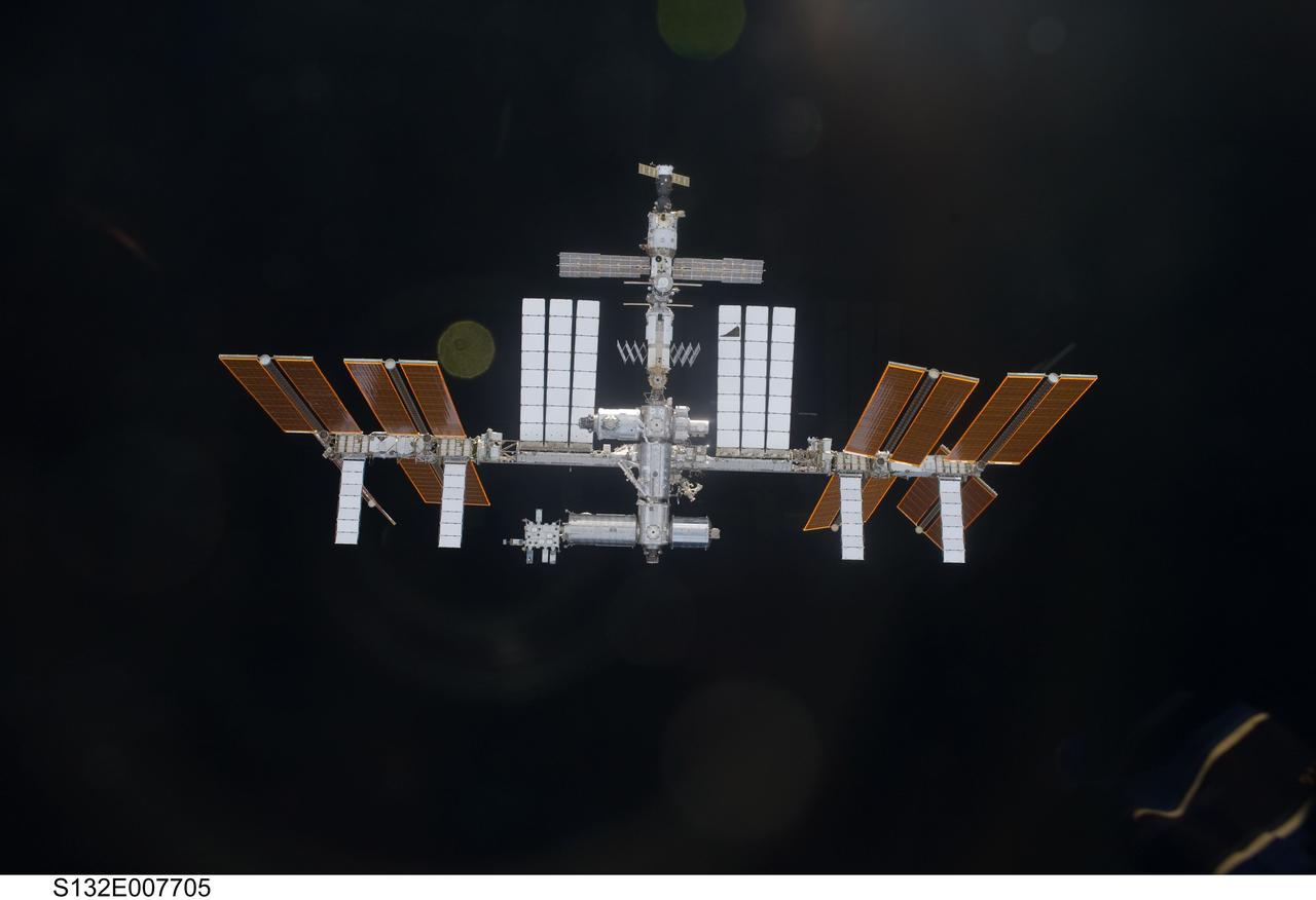 S132-E-007705 (16 May 2010) --- The International Space Station is featured in this image photographed by an STS-132 crew member on space shuttle Atlantis as the shuttle approaches the station during rendezvous and docking operations. Docking occurred at 9:28 a.m. (CDT) on May 16, 2010.