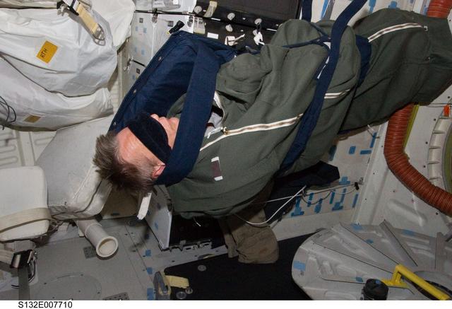 NASA image: Sellers in sleeping bag on the MDDK during STS-132