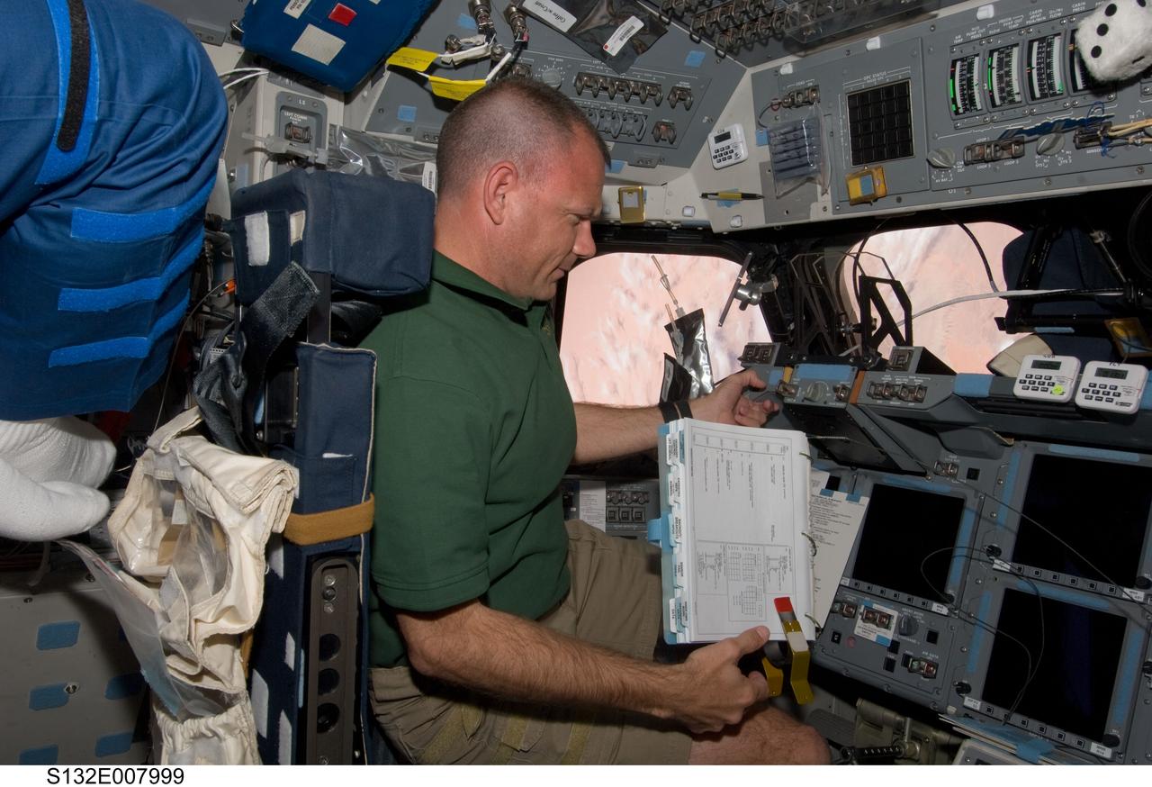S132-E-007999 (16 May 2010) --- NASA astronaut Tony Antonelli, STS-132 pilot, occupies the commander’s station on the forward flight deck of space shuttle Atlantis during flight day three activities.
