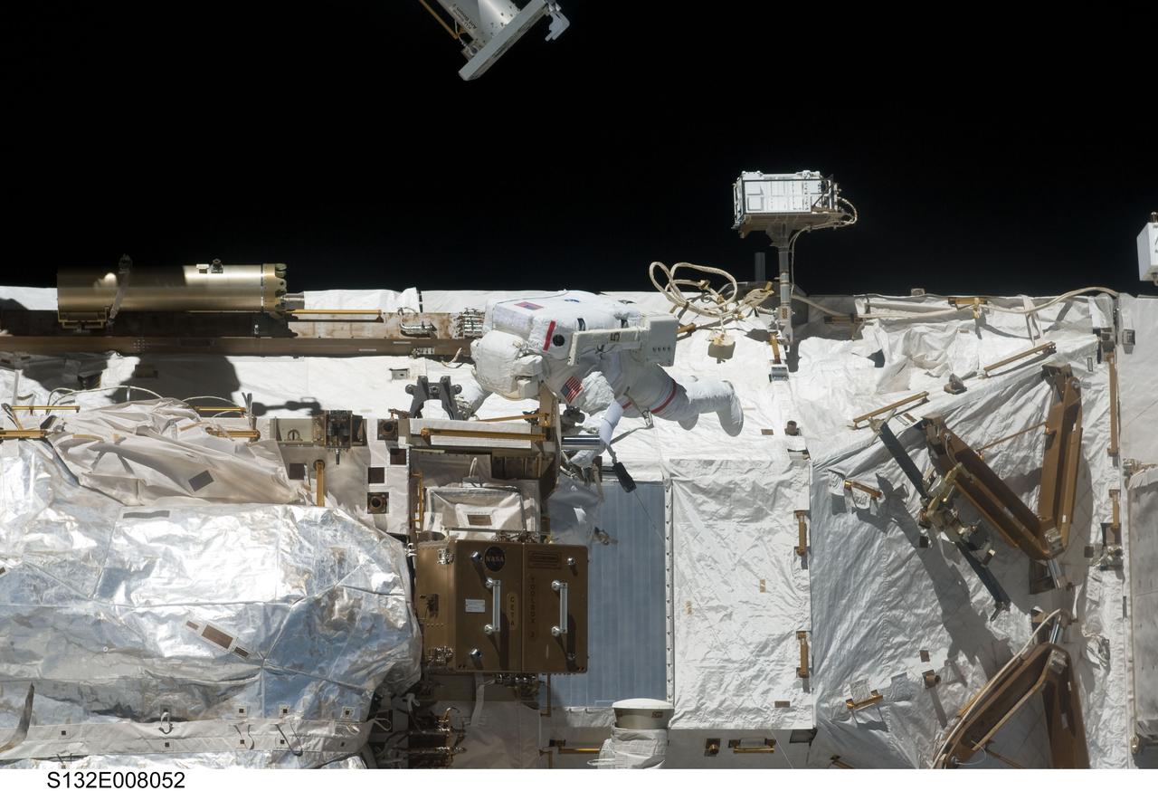 S132-E-008052 (17 May 2010) --- NASA astronaut Steve Bowen, STS-132 mission specialist, participates in the mission's first session of extravehicular activity (EVA) as construction and maintenance continue on the International Space Station. During the seven-hour, 25-minute spacewalk, Bowen and NASA astronaut Garrett Reisman (out of frame), mission specialist, loosened bolts holding six replacement batteries, installed a second antenna for high-speed Ku-band transmissions and adding a spare parts platform to Dextre, a two-armed extension for the station’s robotic arm.