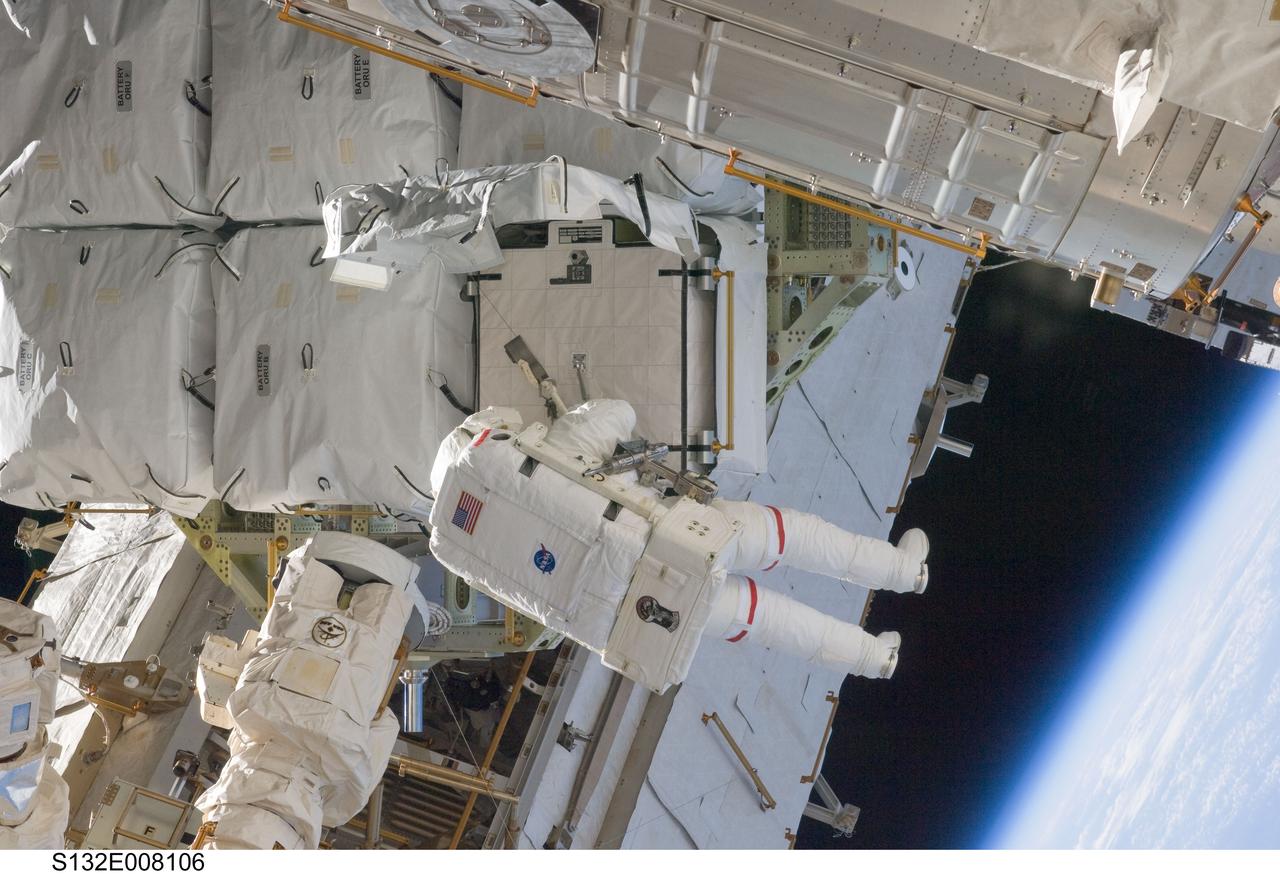 S132-E-008106 (17 May 2010) --- NASA astronaut Steve Bowen, STS-132 mission specialist, participates in the mission's first session of extravehicular activity (EVA) as construction and maintenance continue on the International Space Station. During the seven-hour, 25-minute spacewalk, Bowen and NASA astronaut Garrett Reisman (out of frame), mission specialist, loosened bolts holding six replacement batteries, installed a second antenna for high-speed Ku-band transmissions and adding a spare parts platform to Dextre, a two-armed extension for the station’s robotic arm.