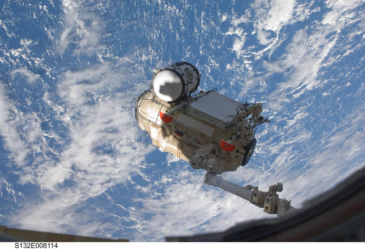 S132-E-008114 (18 May 2010) --- In the grasp of the Canadarm2, the Russian-built Mini-Research Module 1 (MRM-1) is transferred from space shuttle Atlantis’ payload bay to be permanently attached to the Earth-facing port of the Zarya Functional Cargo Block (FGB) of the International Space Station. Named Rassvet, Russian for "dawn," the module is the second in a series of new pressurized components for Russia. Rassvet will be used for cargo storage and will provide an additional docking port to the station.